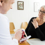 doctor explaining rotator cuff injury to patient