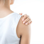 woman experiencing shoulder pain